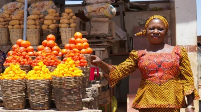Nigerian woman selling goods in market